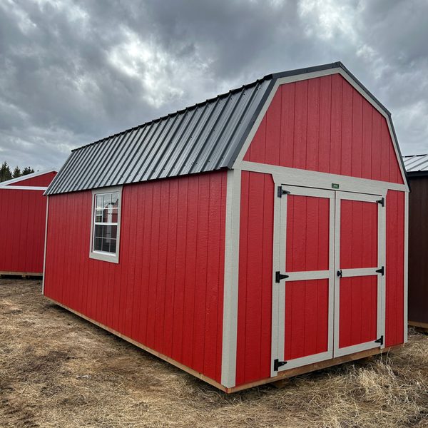 Red Premier lofted storage shed with double doors and metal roof in Alberta